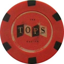 A poker chip from  the Tops Casino.